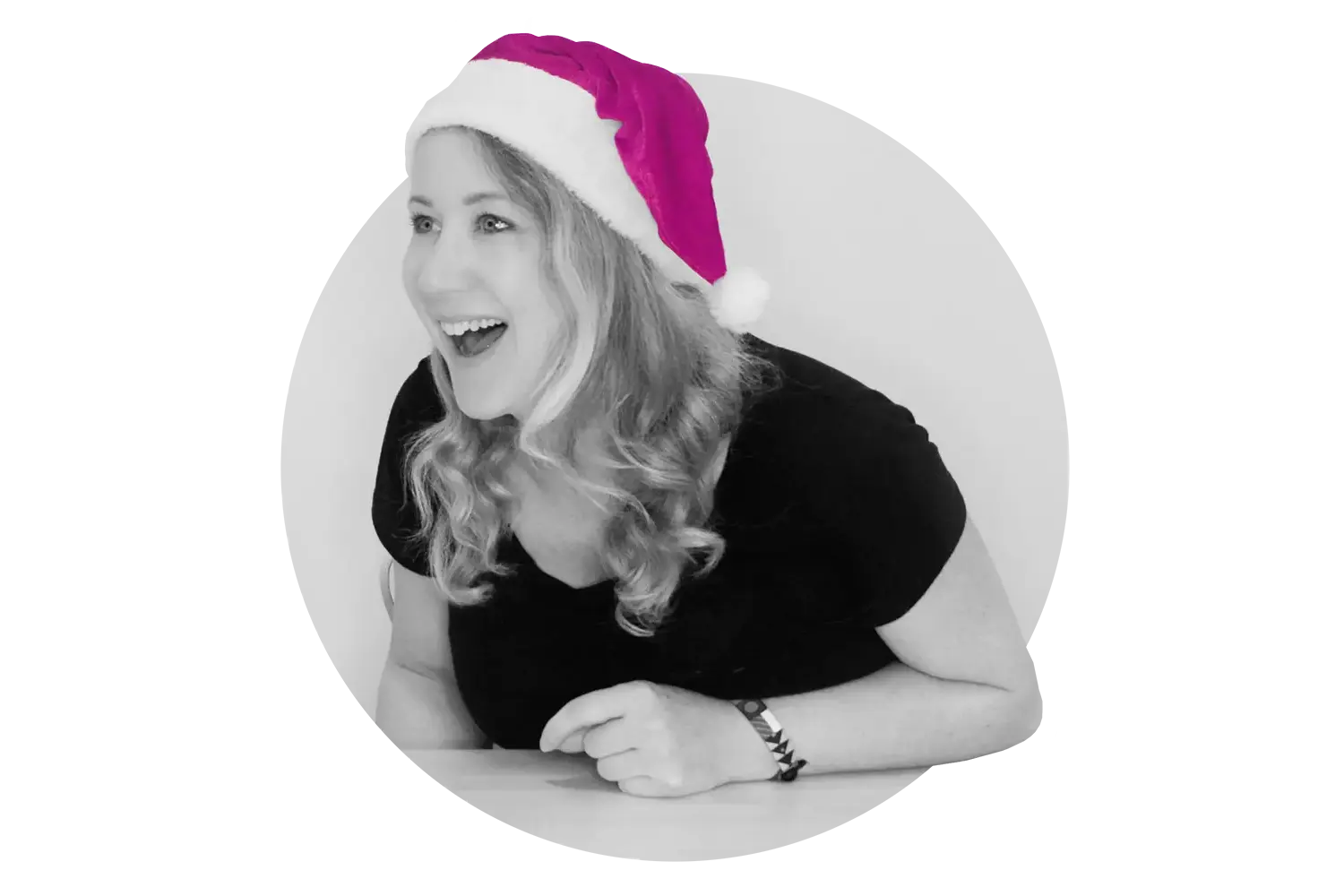 Britta Just in Black & White wearing a pink Santa hat and laughing as symbol for good reasons to run an online advent calendar for your business.